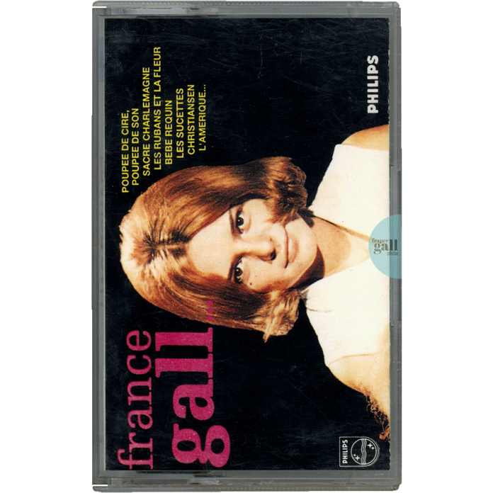 Compilation au format cassette transparente de Sacré Charlemagne éditée en 1990 pour le Club Dial contenant 23 titres de France Gall parus entre 1963 et 1967.