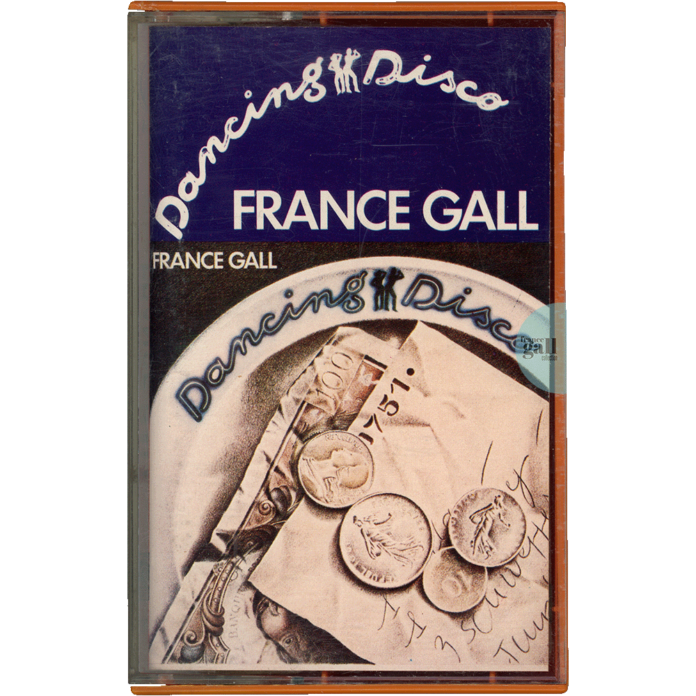 Album avec un boitier orange et une cassette de couleur grège de Dancing Disco, le second album studio que Michel Berger a produit pour France Gall en 1977.